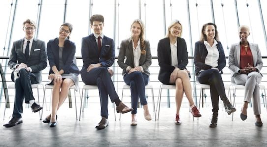 Several job candidates wait for their job interview