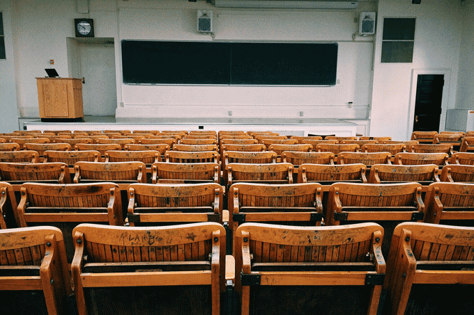 An empty college classroom symbolizing how there’s a decline in college enrollment in 2022 and why college isn’t 100% necessary for getting a job today